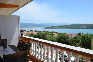 a balcony with a view of a lake at Apartments Rose in Čižići