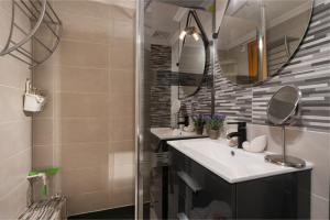 a bathroom with two sinks and a mirror at Violet House - Alcúdia in Alcudia +14 photos