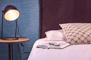 Posteľ alebo postele v izbe v ubytovaní Málaga Central Suites
