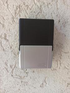 a small gray and black box on a wall at Alesia in Oradea