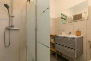 a bathroom with a shower and a sink at Arrifana Pines in Aljezur
