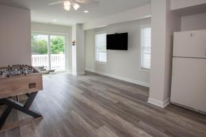 an empty living room with a ping pong table at Lazy Day-Z in Virginia Beach