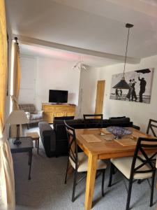 a living room with a table and a couch at Church View at Plover Cottage Lindley in Huddersfield