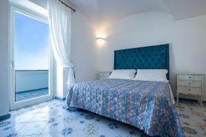 A bed or beds in a room at Villa Primavera