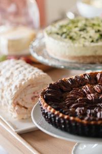 a table topped with pies and cakes on plates at Teach de Broc in Ballybunion