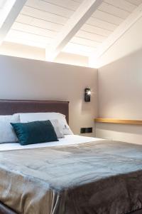 Ein Bett oder Betten in einem Zimmer der Unterkunft De Gulia Charme and Relax