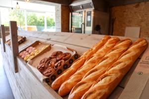 a table with a bunch of bread and other pastries at EuroParcs Schoneveld in Breskens