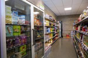 an aisle of a grocery store with food at EuroParcs Schoneveld in Breskens