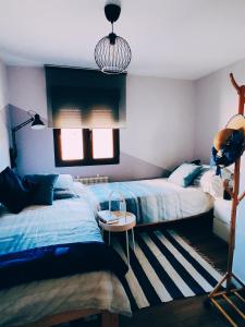 A bed or beds in a room at El Rincón del Alma Mía