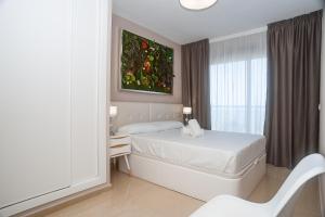 Posteľ alebo postele v izbe v ubytovaní Holiday Deluxe Apartment Miramar Magic World + 37 fotografií