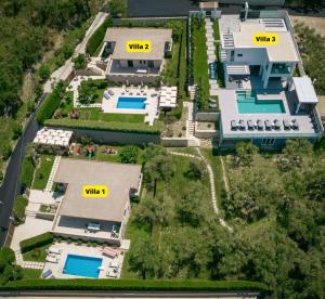 an aerial view of a villa with two swimming pools at Vatia Villas in Tragaki