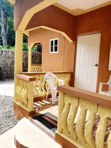 a model of a house with a balcony at Mesmerize Guest House in Port Antonio