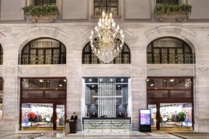 a large building with a chandelier in the middle at Legacy Ottoman Hotel Istanbul Old City in Istanbul