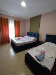 Postel nebo postele na pokoji v ubytování Lungomare Beach Apartments