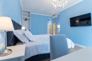 Finest rooms Leonilda客房内的一张或多张床位