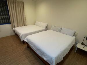 Een bed of bedden in een kamer bij Meet ‧ Happiness B&B