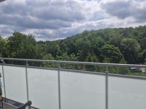 a balcony with a view of a mountain at Apartament Morski in Gdynia