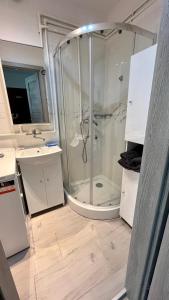 a bathroom with a shower and a sink at MŁAWSKA 33 in Rypin +10 photos
