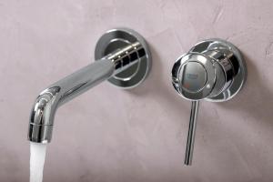 a sink faucet with water coming out of it at Sivota Deamaris Luxury Boutique Hotel in Syvota