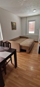 Una cama o camas en una habitación de Apartman MAŠA
