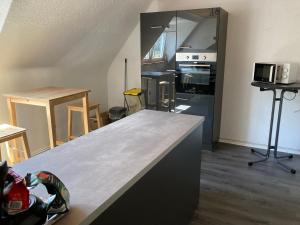 a kitchen being remodeled with a counter top at KRIO Nicola Rothfuchs Ferienwohnung 2 in Idar-Oberstein
