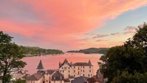 a view of a town with a large body of water at Little bay cabin in Oban