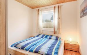 מיטה או מיטות בחדר ב-Ferienhaus 27 Altefhr