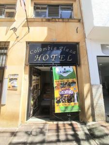 a store with a sign in the front of a building at San Gil Tours Hostal in San Gil