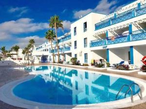 a large swimming pool in front of a building at Blue Ocean in Puerto del Carmen