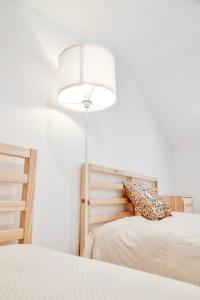מיטה או מיטות בחדר ב-Rest House - Vila do Conde