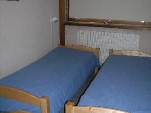 Una cama o camas en una habitación de Appartement La Plagne, 3 pièces, 6 personnes - FR-1-455-95