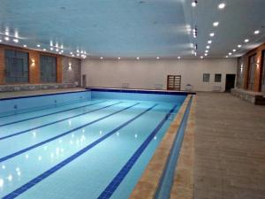 Bazén v ubytování Eventi Club by cité des sports adarissa nebo v jeho okolí