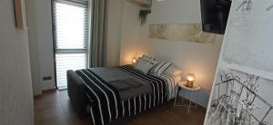 Łóżko lub łóżka w pokoju w obiekcie ZARAUTZ LOFT 1