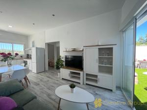 a living room with a couch and a table at Casa Nina in Vejer de la Frontera