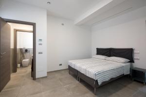 מיטה או מיטות בחדר ב-Villino Liber