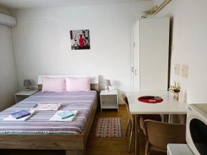 Posteľ alebo postele v izbe v ubytovaní City Center Apartments
