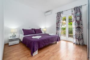 Posteľ alebo postele v izbe v ubytovaní Holiday House Josip
