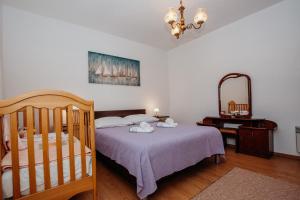 Posteľ alebo postele v izbe v ubytovaní Apartman Neli