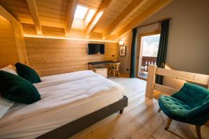 Postel nebo postele na pokoji v ubytování Alpi & Golf Hotel