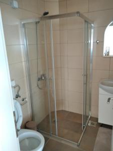 a bathroom with a shower and a toilet at Jasmin in Ulcinj