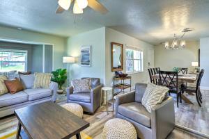 a living room with a couch and chairs and a table at Merritt Island Oasis with Pool about 7 Mi to Beach! in Merritt Island