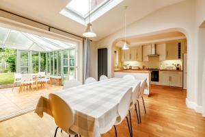 a kitchen and dining room with a table and chairs at 11 Beech Road in Weymouth