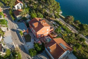 an overhead view of a house with the water at Villa Teresa in Mali Lošinj