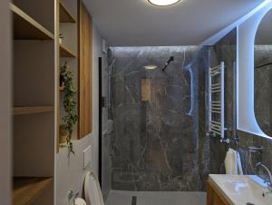 a bathroom with a shower and a toilet and a sink at [VerdeS] - Joyride Exclusive Apartment in Oradea