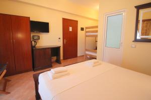 Postel nebo postele na pokoji v ubytování Oskar Hotel