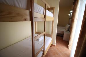 Postel nebo postele na pokoji v ubytování Oskar Hotel
