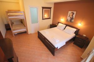 Postel nebo postele na pokoji v ubytování Oskar Hotel