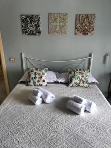 two towels on a bed with two pillows at B&B Marìsicilia in Porto Empedocle
