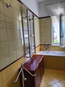 a bathroom with a tub and a sink and a window at B&B Marìsicilia in Porto Empedocle