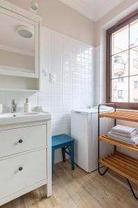 Posteľ alebo postele v izbe v ubytovaní Apartament Wigilijna Starówka